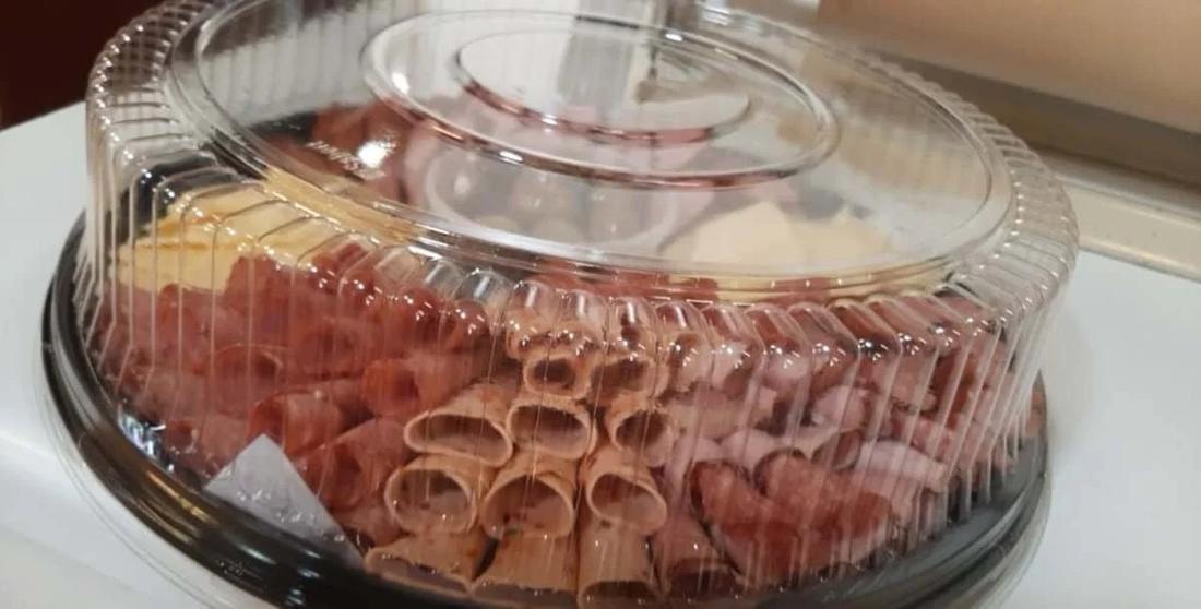 A deli meat and cheese party platter under a dome at Hansel Deli in Surrey BC